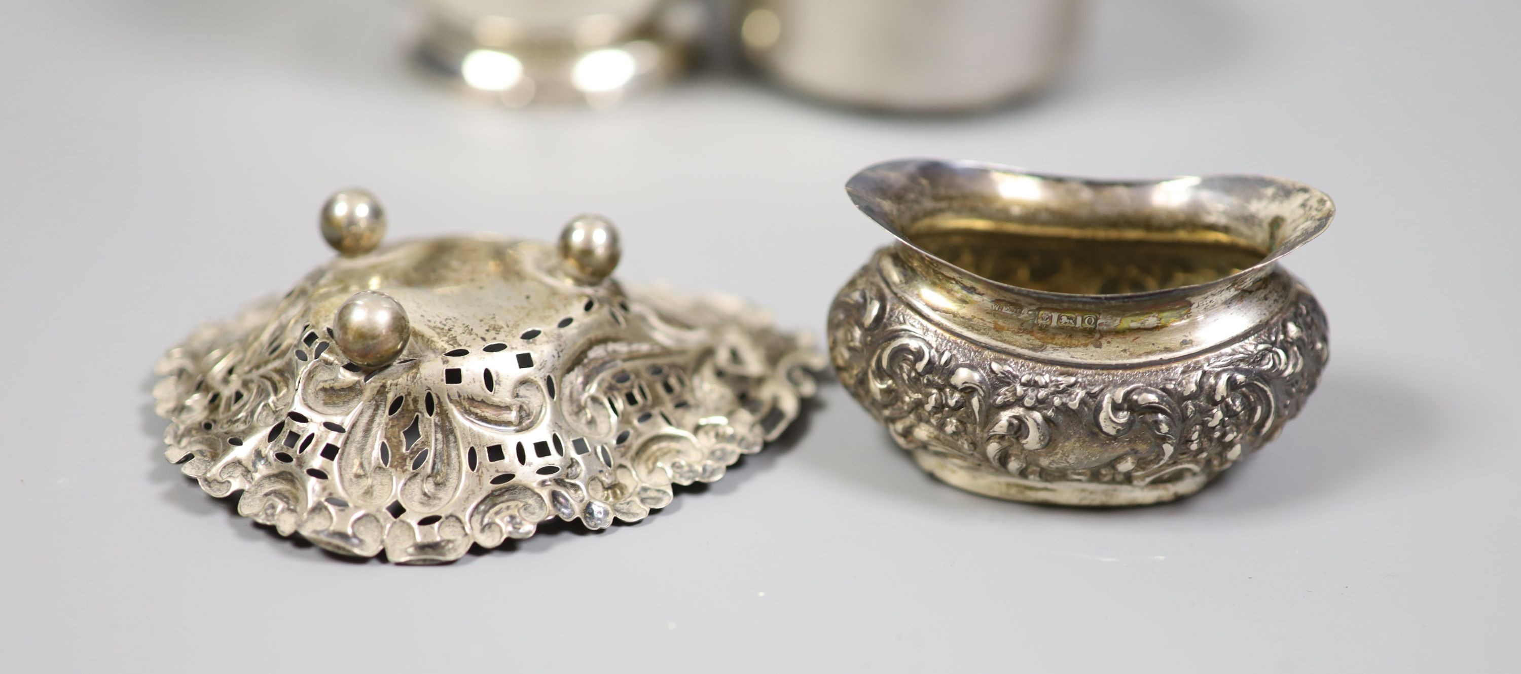 Mixed silver and sterling items including two mugs, two sauce ladles, salt thimble, nut dish and two silver handled implements